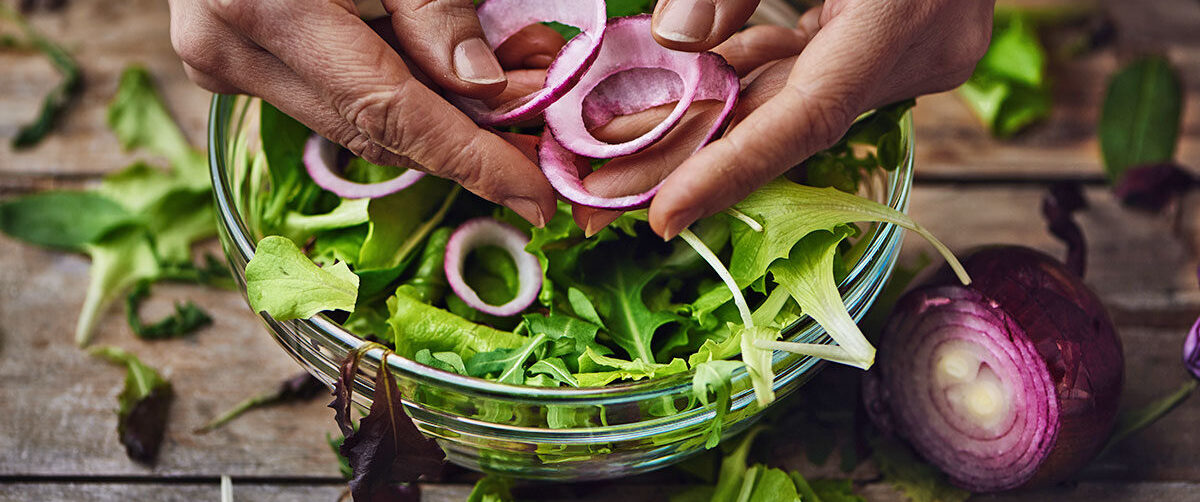 Hands Preparing Salad